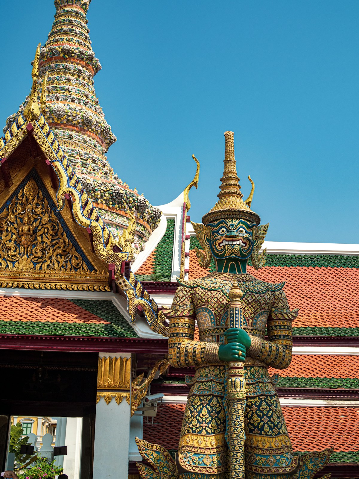 Yaksha giant demon guardian statue in traditional Thai costume at Wat Phra Kaew, Grand Palace complex, Bangkok