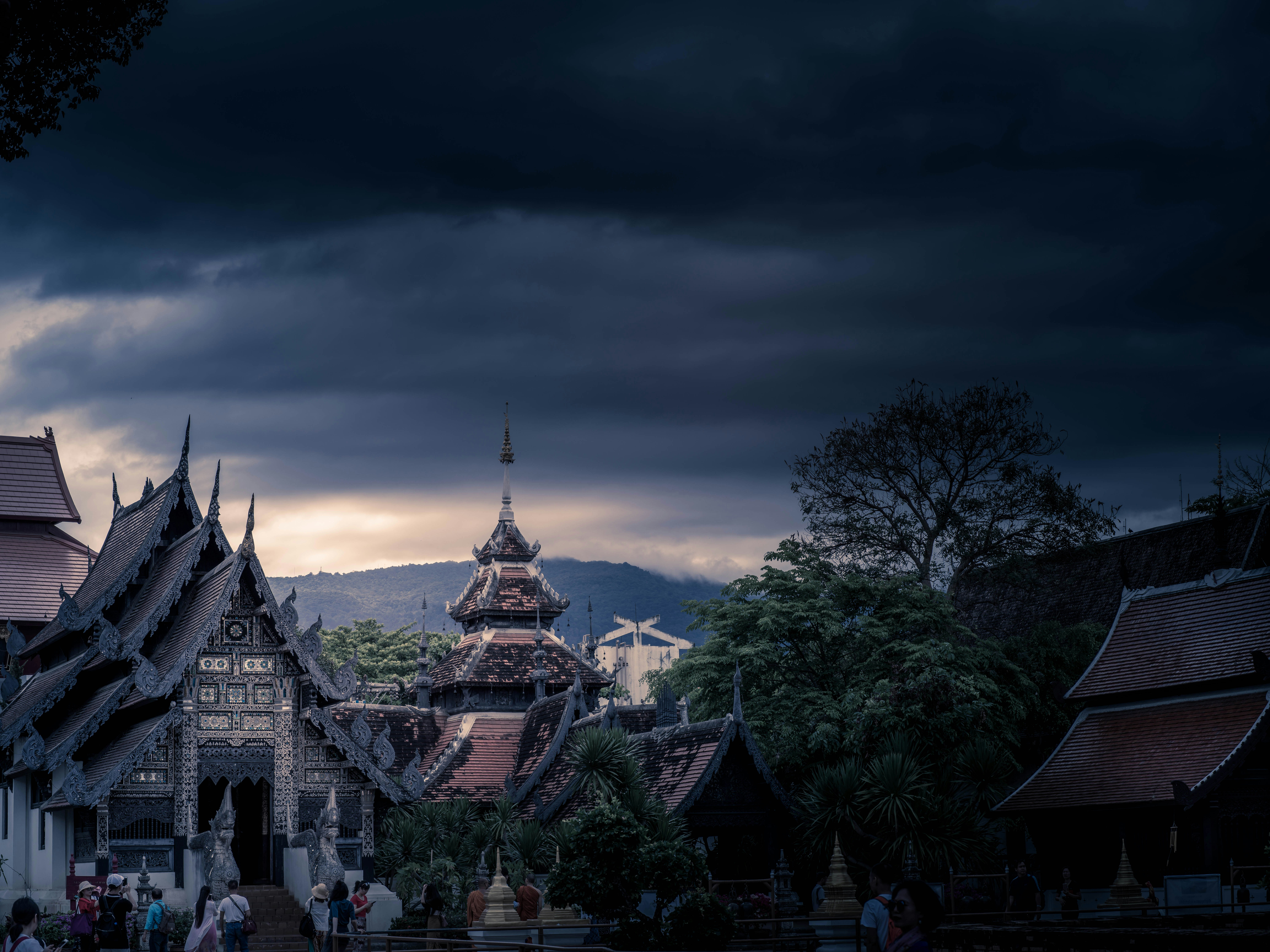 Traditional Thai temple complex in Chiang Mai on a dramatic stormy evening