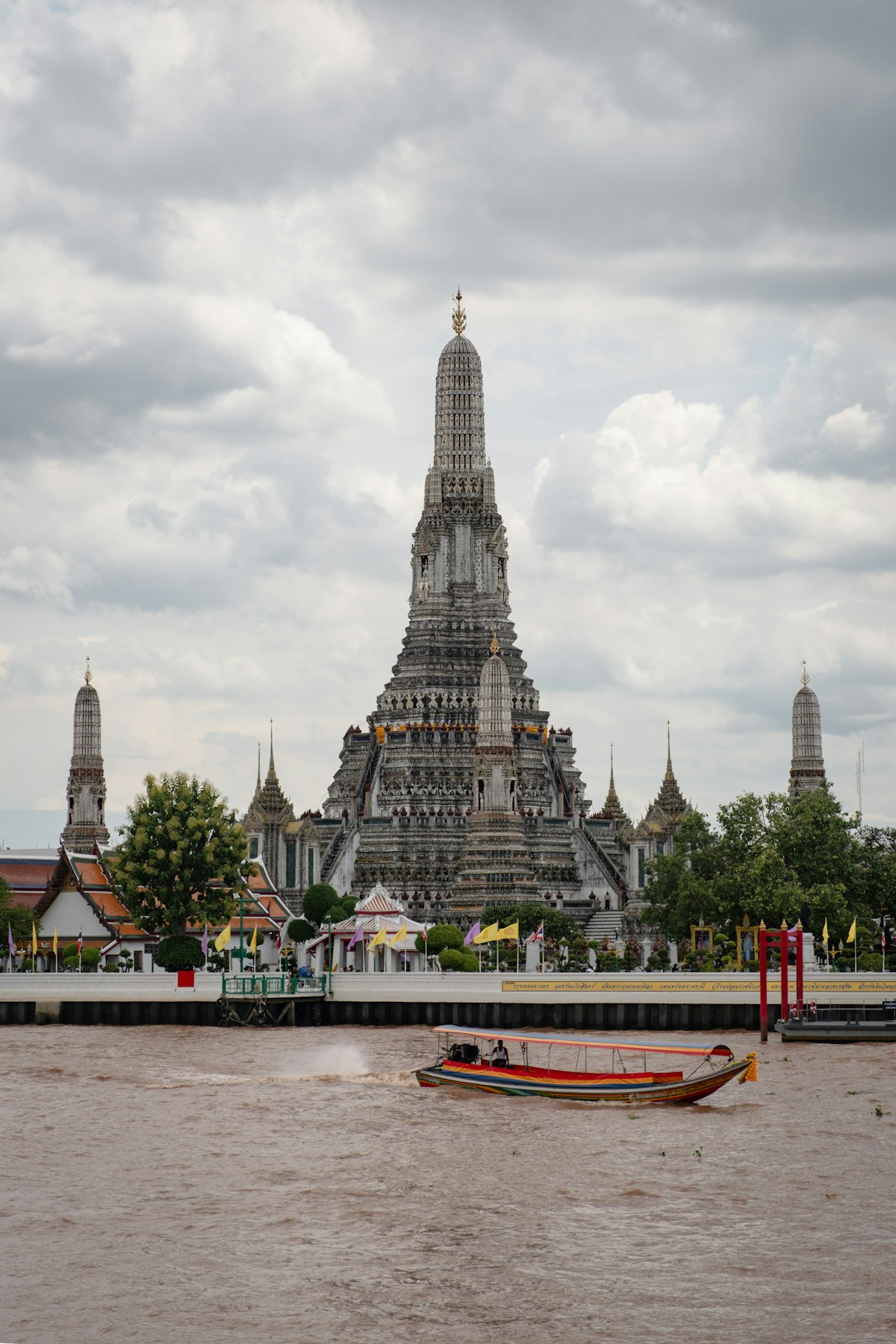 Bangkok skyline and golden temple spires along the Chao Phraya River