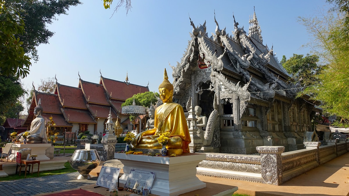 Golden Buddha statue with the Silver Temple (Wat Sri Suphan) in Chiang Mai