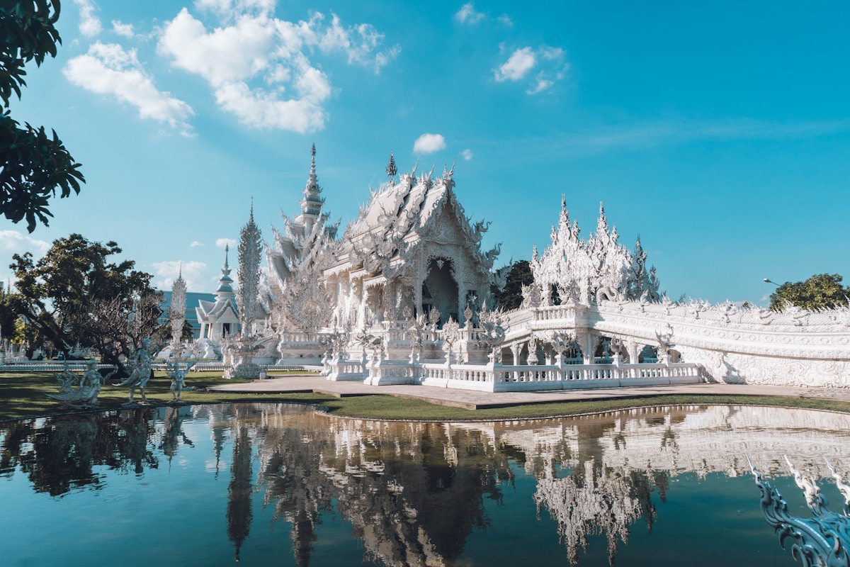 The ornate white facade of Wat Rong Khun (White Temple) in Chiang Rai