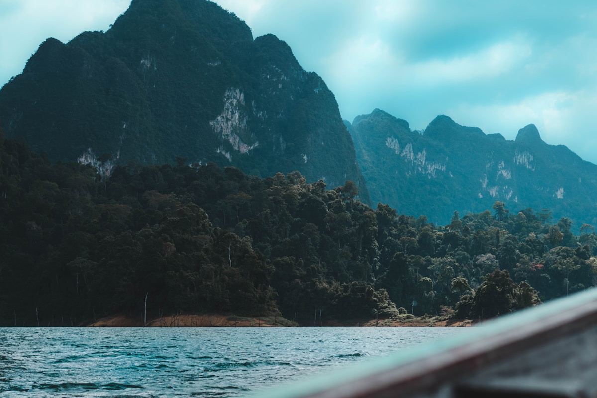 Limestone karst mountains reflected in Cheow Lan Lake, Khao Sok National Park