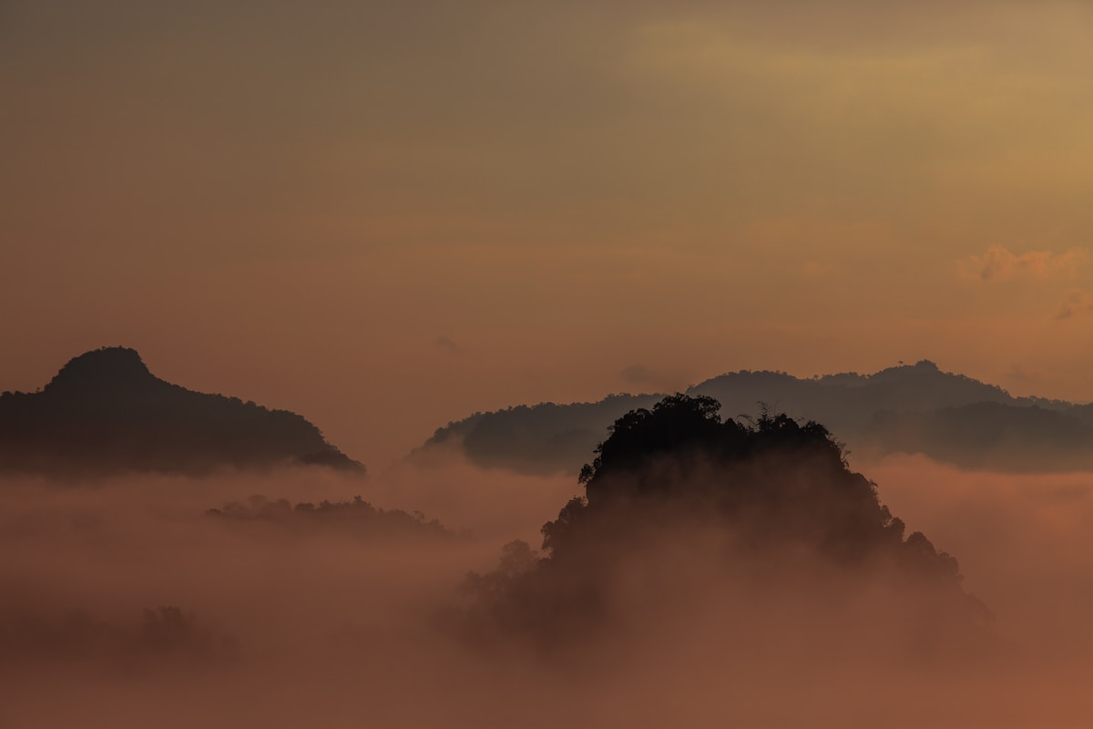 Morning mist over forested mountains surrounding Mae Hong Son valley