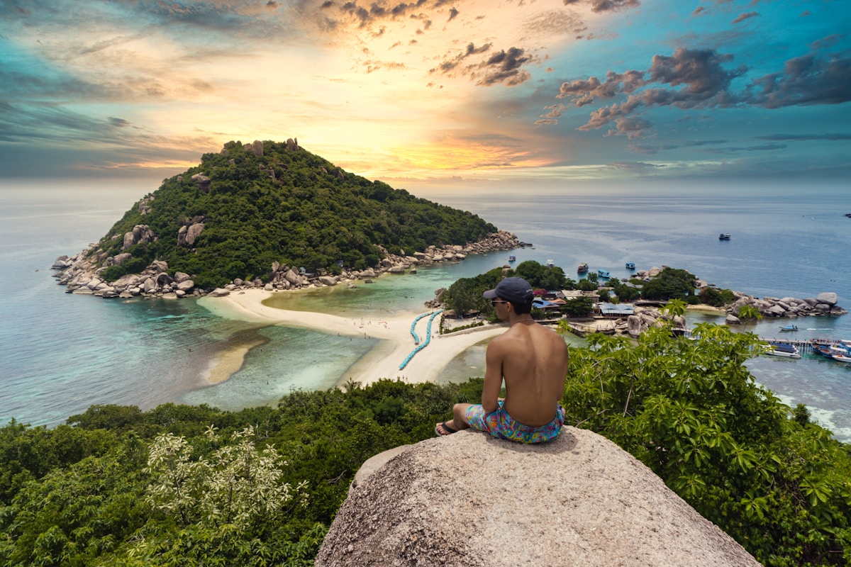 Crystal clear water and coral reef visible from Koh Tao's beach shore