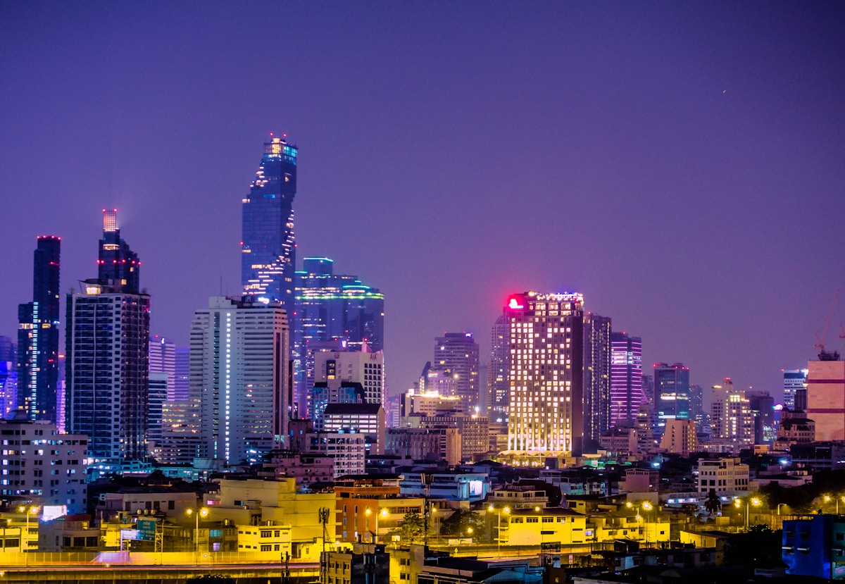 Bangkok city high-rise buildings lit up at night, Thailand