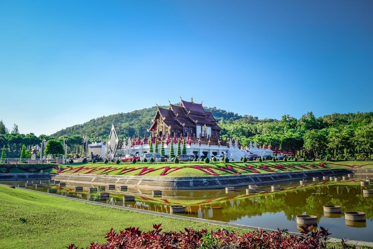Gilded stupa and red-roofed wihan at a Lanna temple in Chiang Mai