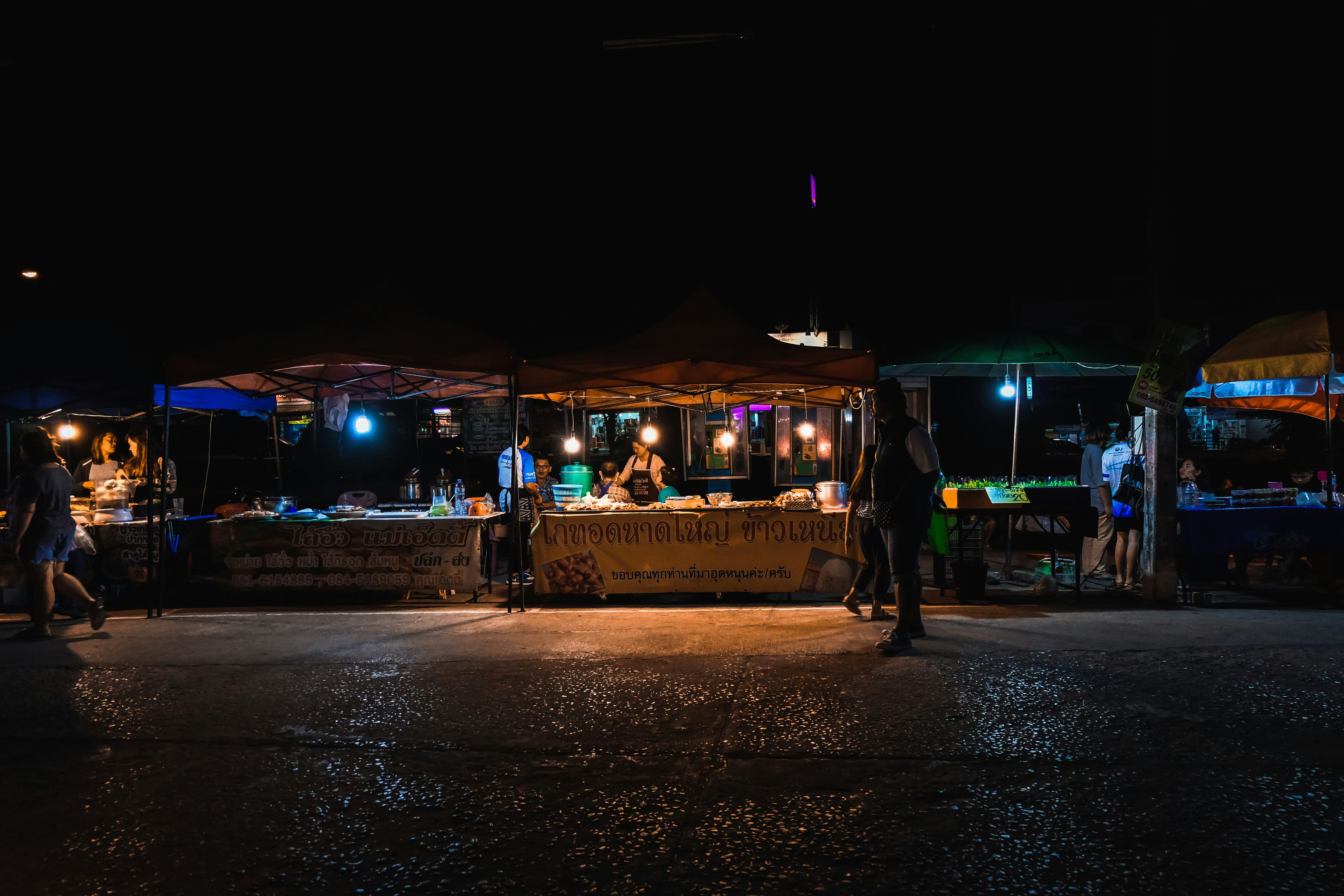 Colourful lanterns and food stalls at Chiang Rai's Saturday Walking Street market at night