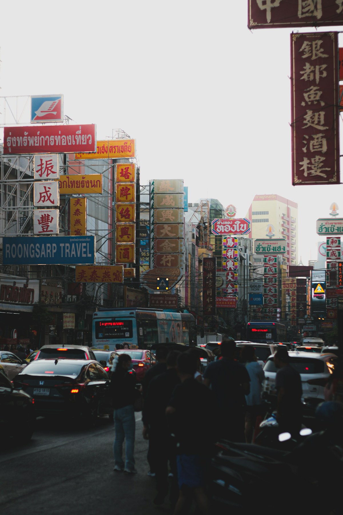 Neon signs and street food stalls at night on Yaowarat Road, Bangkok Chinatown