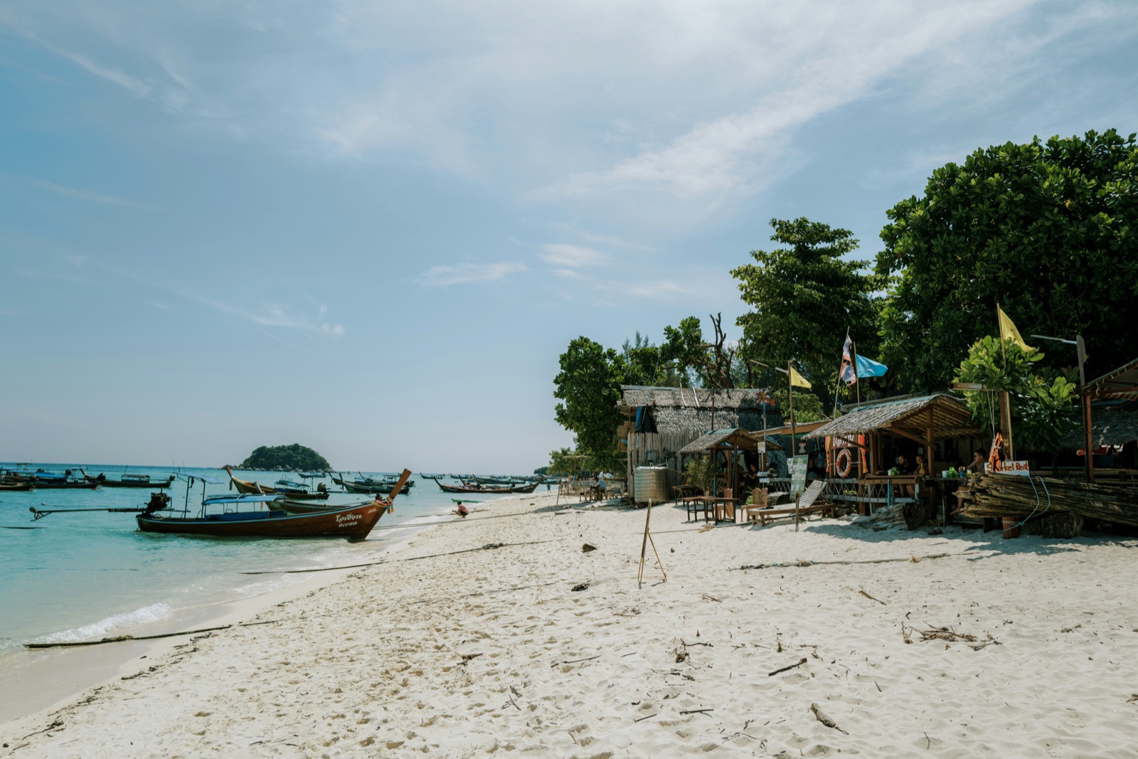 Longtail boats on white sand beach with turquoise water, Koh Lipe, Satun, Thailand