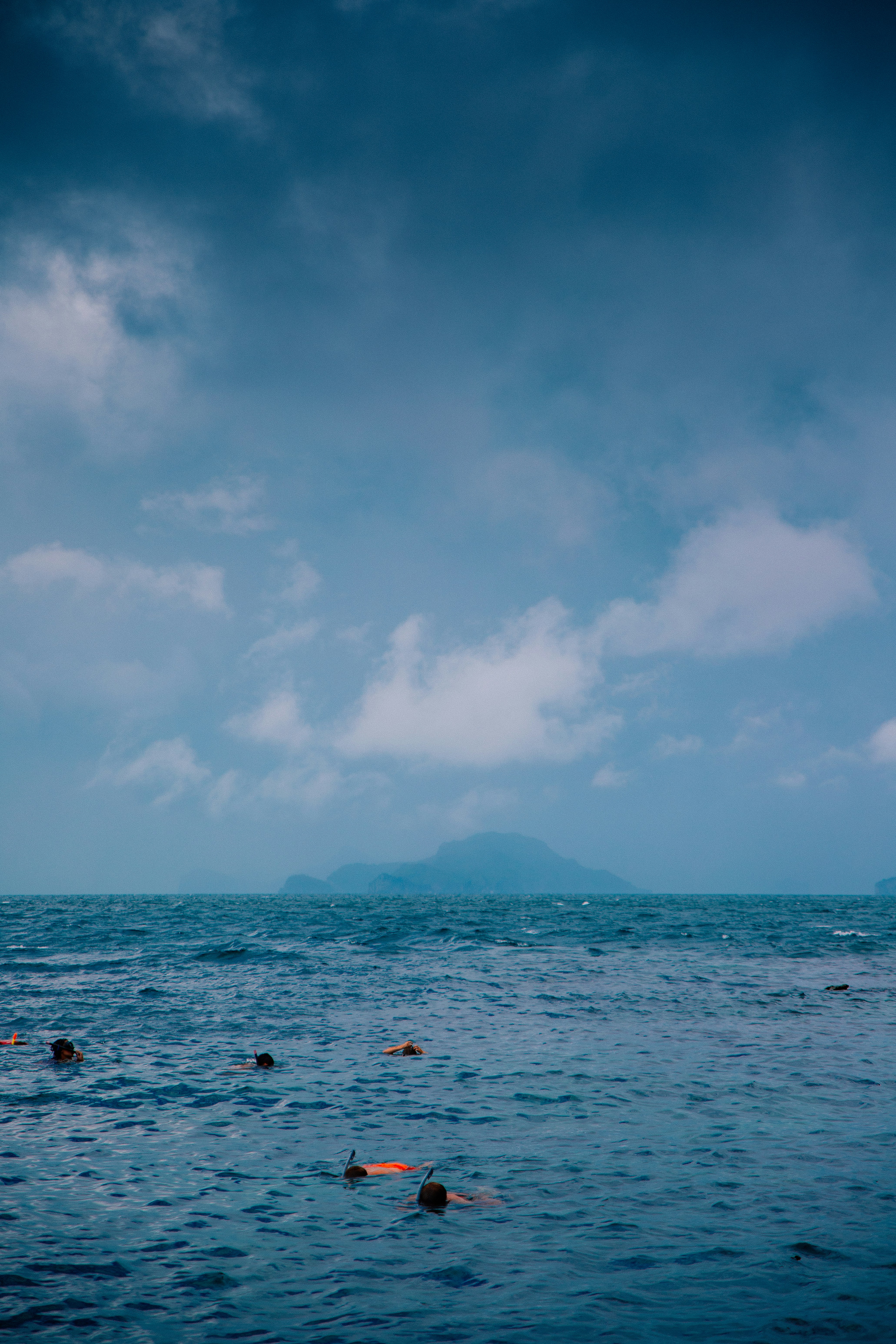 Snorkeler above a coral reef with tropical fish near Koh Samui in the Gulf of Thailand