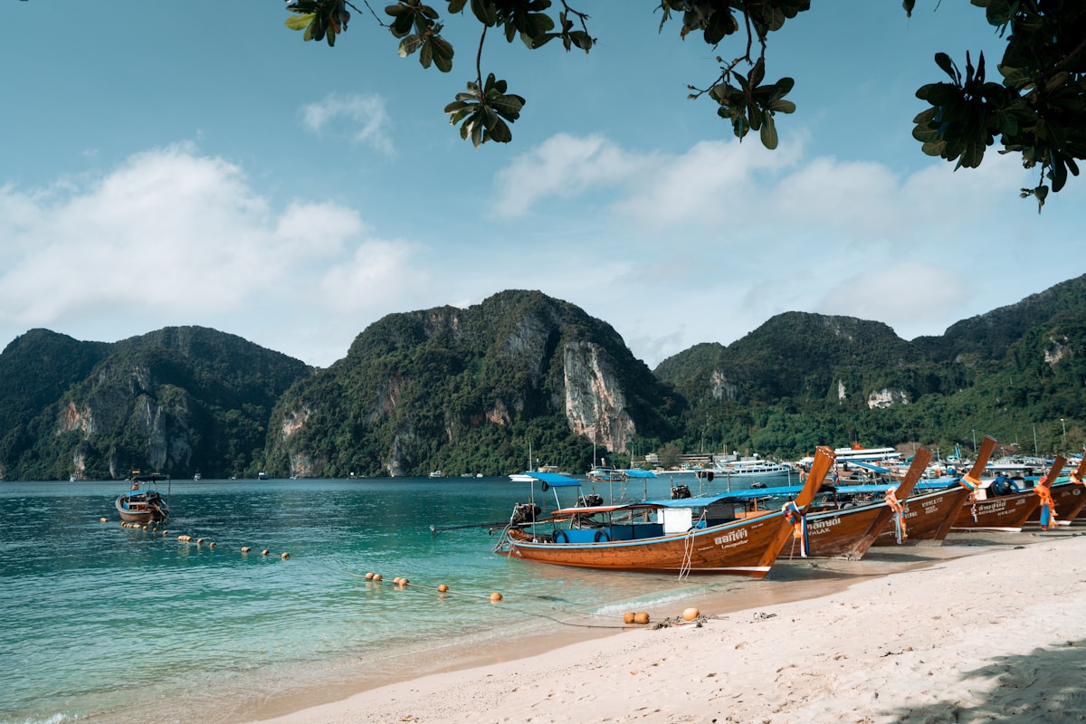 Tropical beach with longtail boat - three-week Thailand itinerary overview