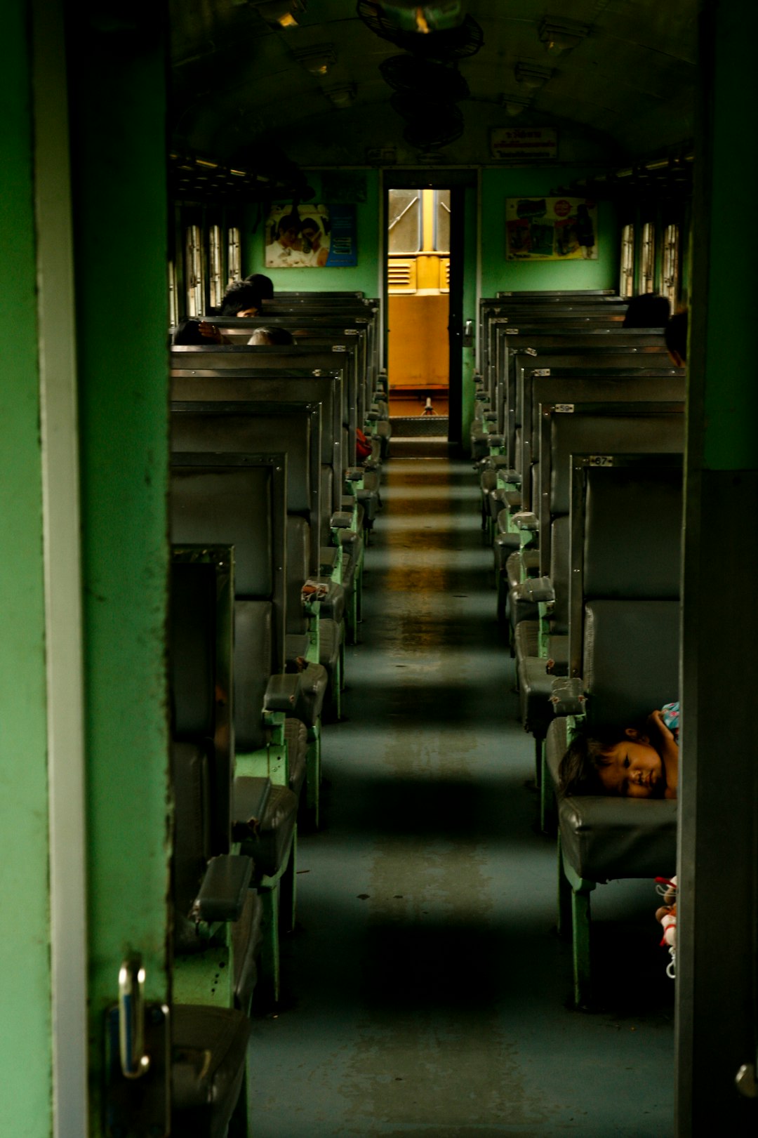 Interior of a Thai State Railway sleeper car showing green and grey berths