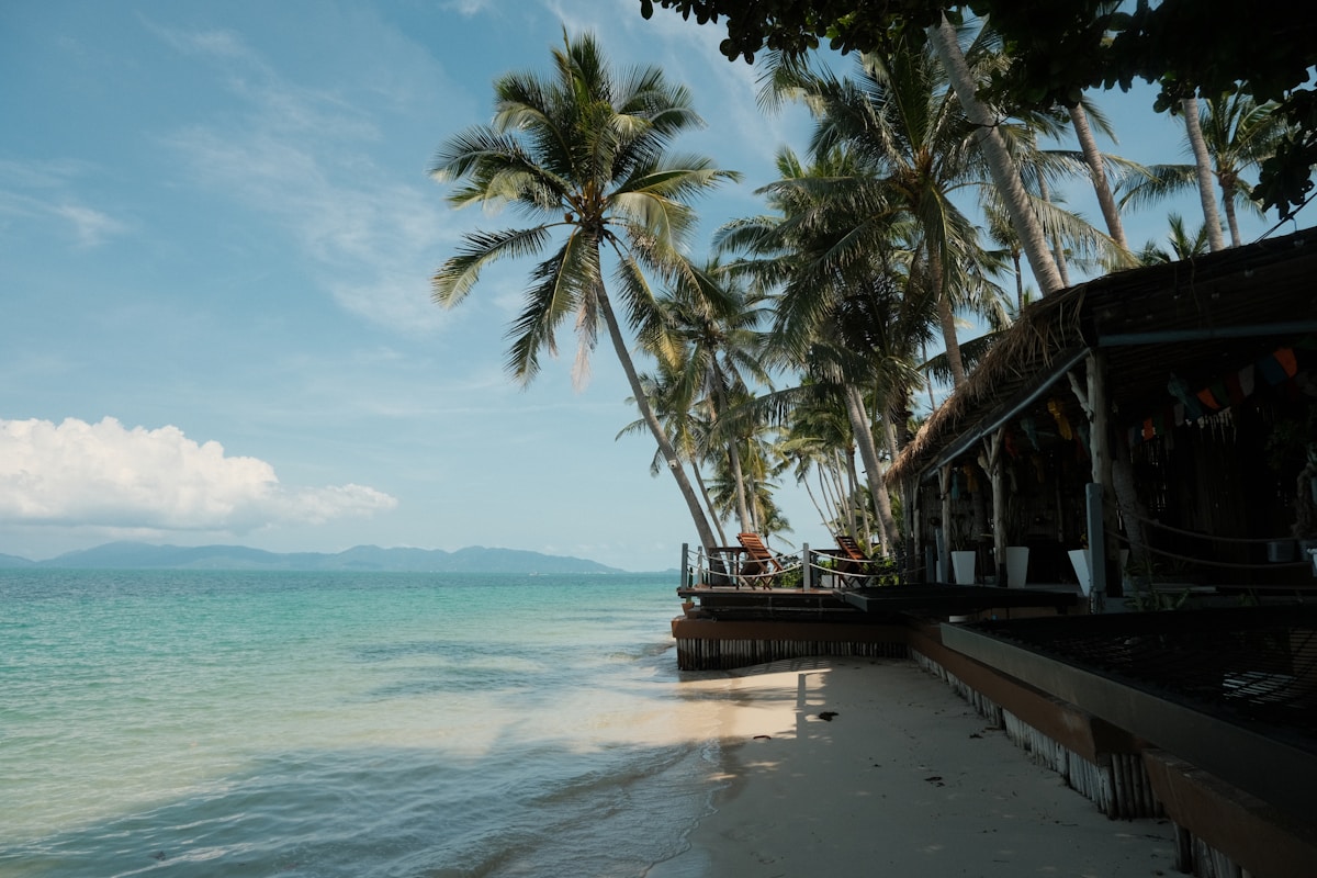 Ferry crossing to Koh Samui with tropical island silhouette in background