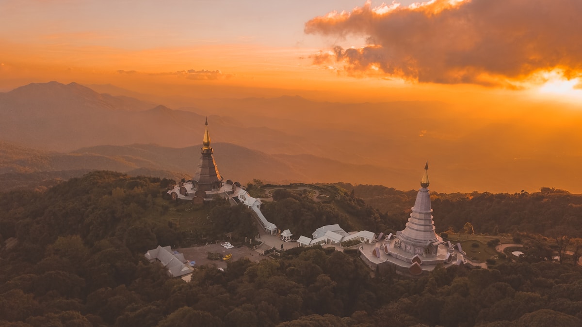 Aerial view of twin royal pagodas at golden hour, Doi Inthanon summit, Chiang Mai, Thailand