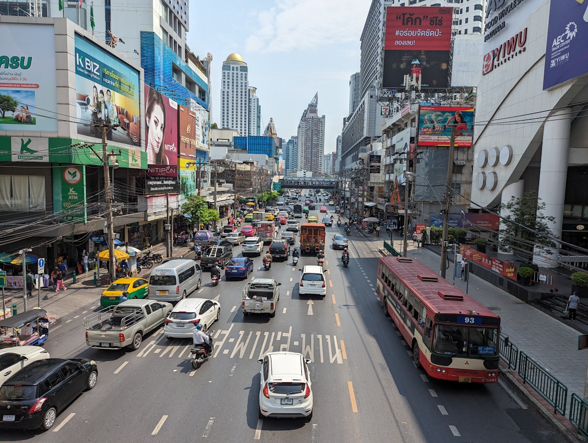 Busy city street with traffic and buildings, Bangkok, Thailand