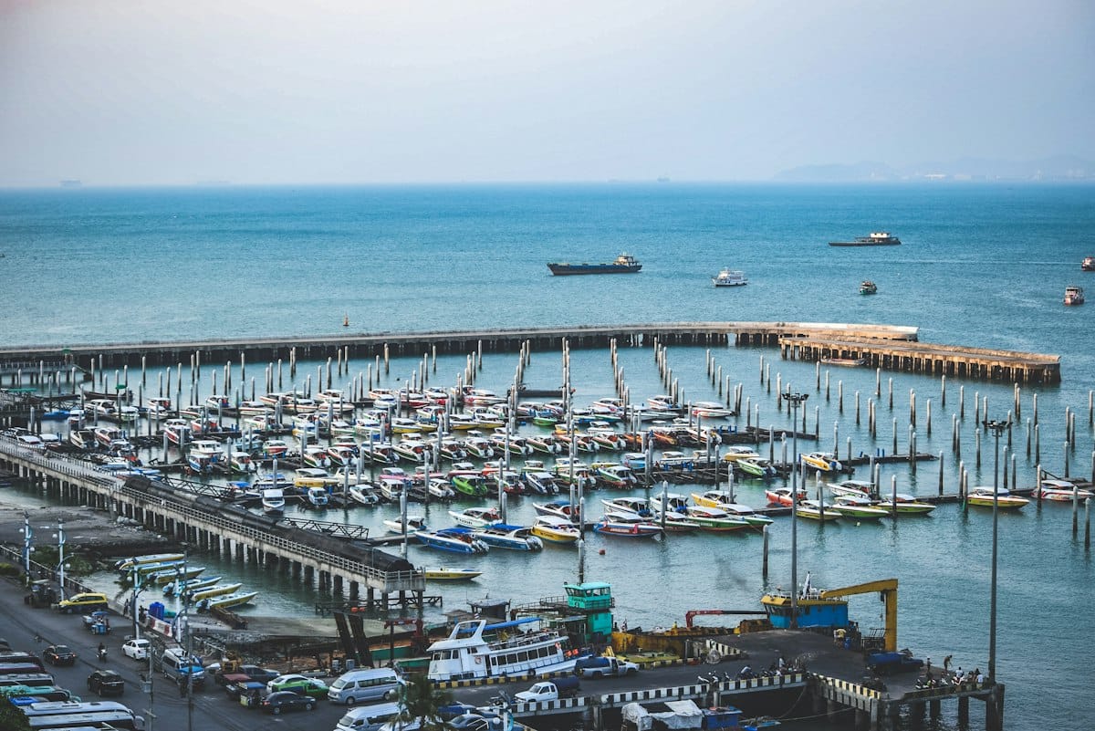 Aerial view of Pattaya harbour marina with boats and pier, Chon Buri, Thailand