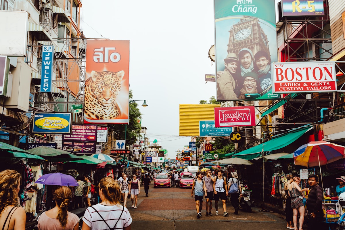 Travellers walking along Khao San Road in Bangkok, Thailand