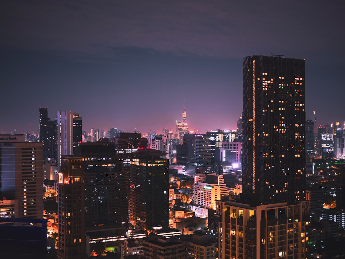 Bangkok skyline at dusk with high-rise hotels along the Chao Phraya River