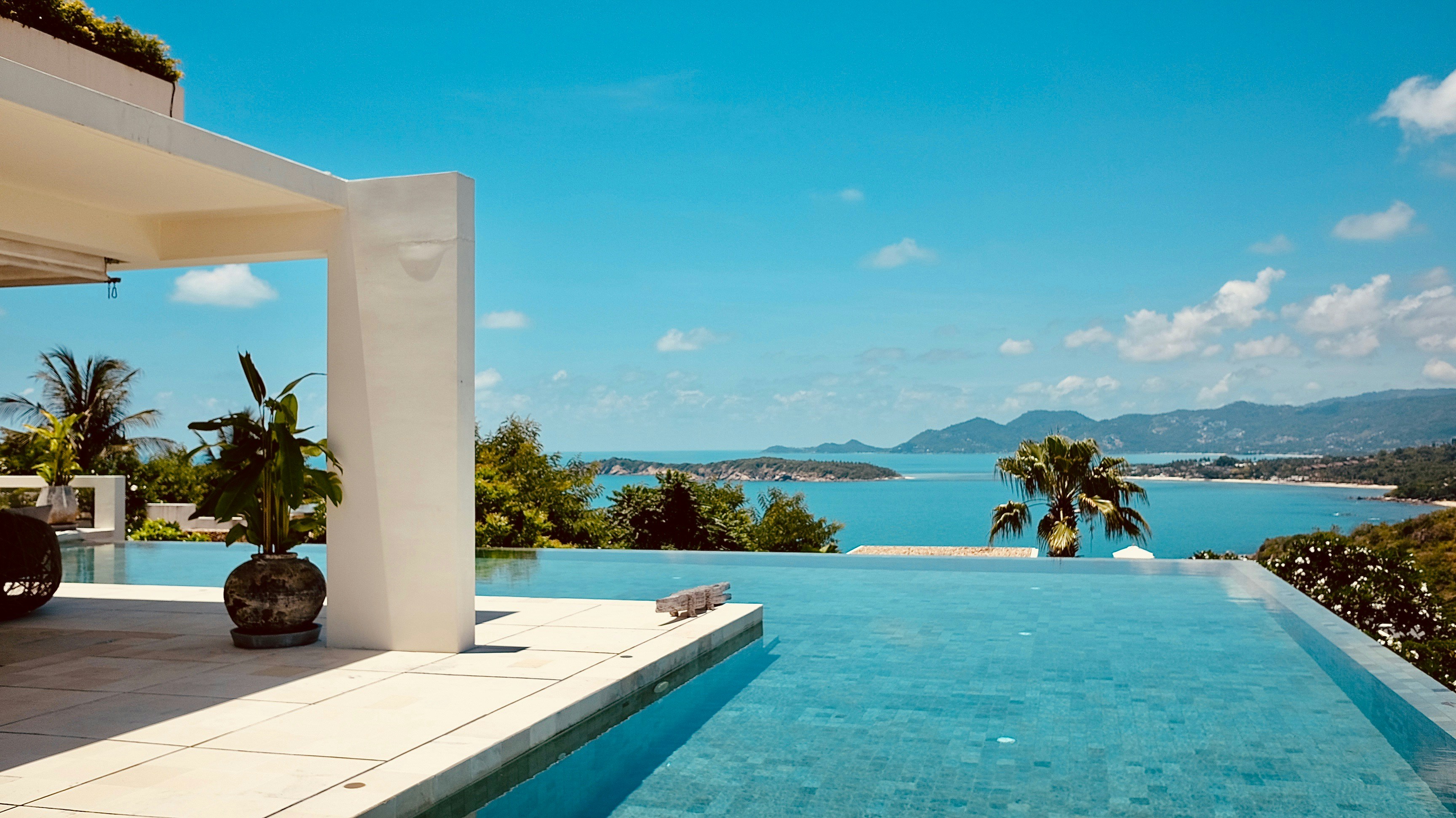 Infinity pool at a hillside villa overlooking the bay at Koh Samui, Thailand
