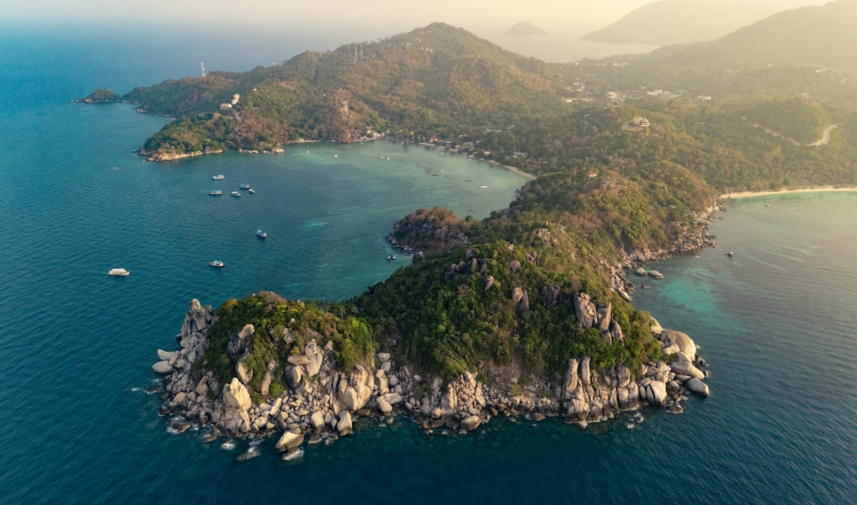 Aerial view of Koh Tao island with rocky coastline and clear turquoise water, Gulf of Thailand