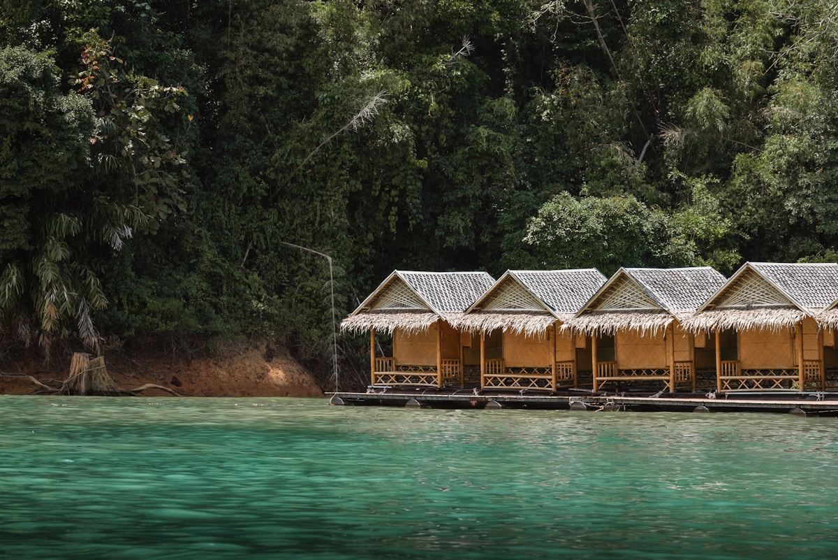 Floating bamboo bungalows on the emerald waters of Cheow Lan Lake, Surat Thani