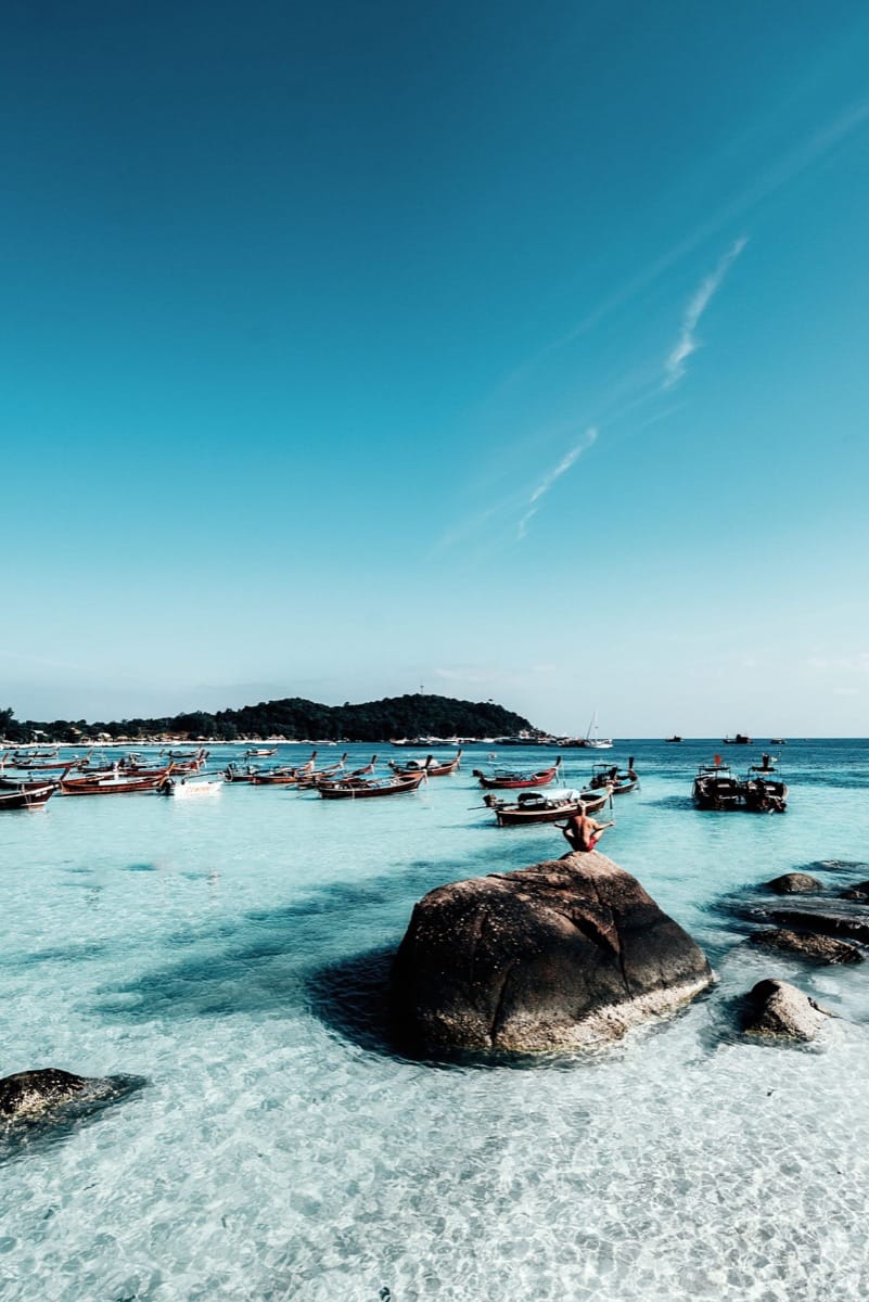 Rocky shore with turquoise water and small islands in the distance, Koh Samet, Rayong Province, Thailand